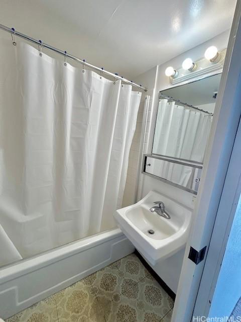 bathroom with tile patterned flooring and shower / bath combination with curtain