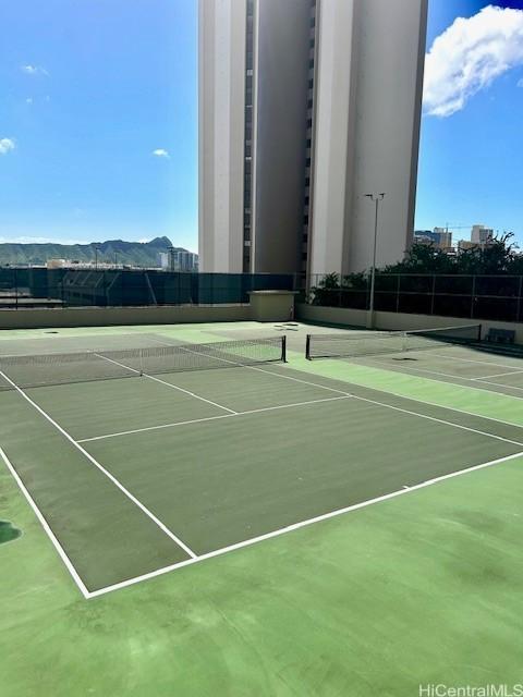 view of sport court with community basketball court and fence