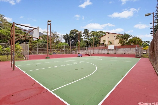 view of basketball court featuring community basketball court and fence