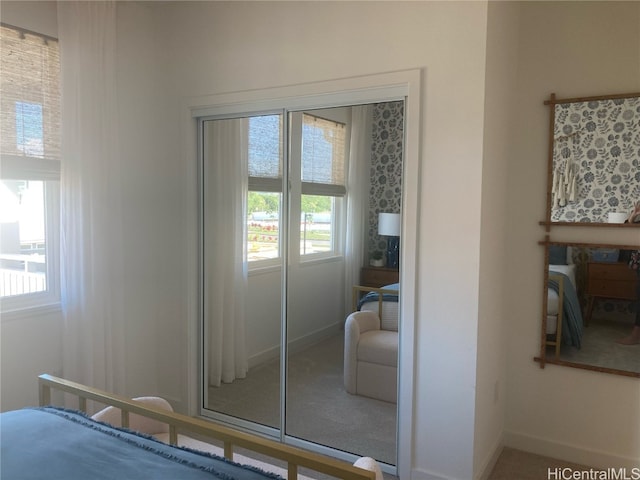 doorway to outside featuring baseboards