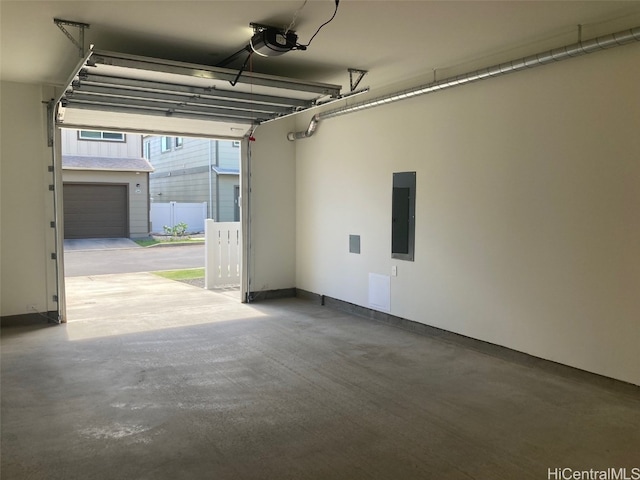 garage featuring a garage door opener and electric panel