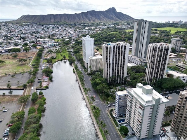 bird's eye view featuring a view of city and a water and mountain view