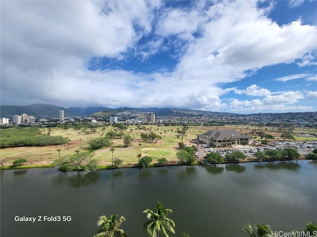 aerial view featuring a water and mountain view