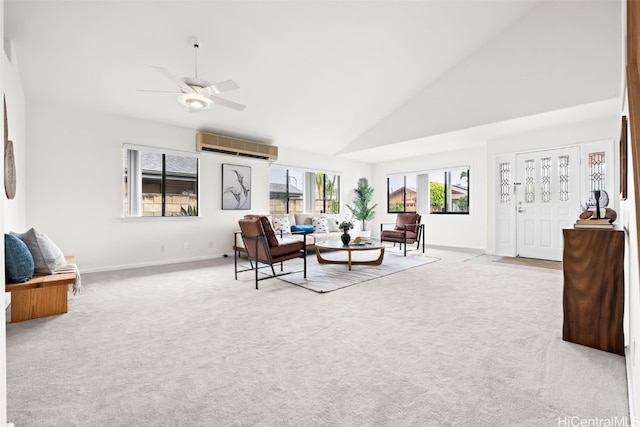 living room with baseboards, high vaulted ceiling, carpet flooring, and a wall unit AC