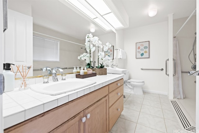 bathroom with tile patterned floors, a shower with curtain, vanity, and toilet