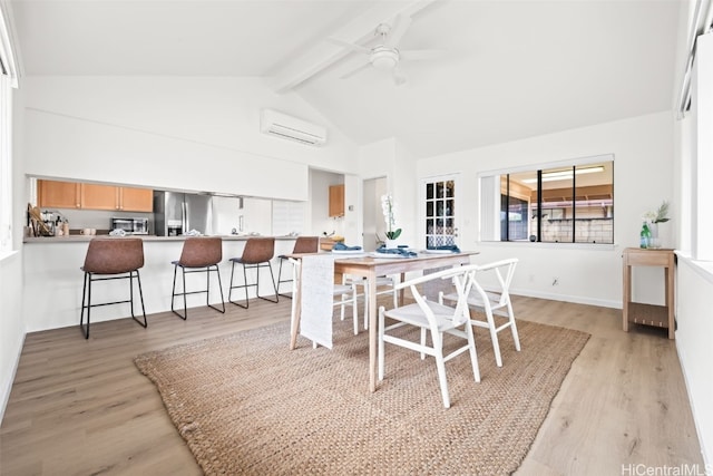 dining room featuring beam ceiling, light wood-style floors, high vaulted ceiling, and a wall unit AC