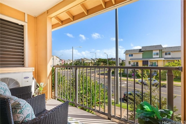 balcony featuring ac unit and a residential view