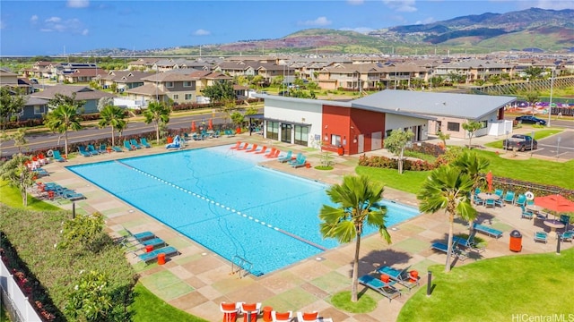 pool with a mountain view and a residential view