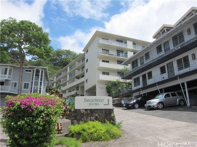 view of property featuring parking