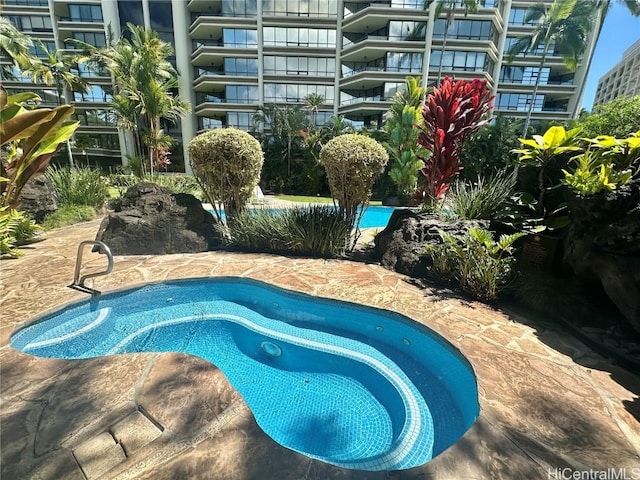 view of swimming pool with a patio area