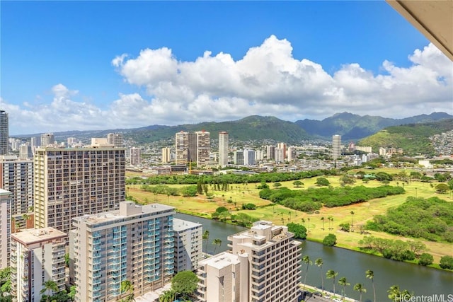 aerial view featuring a view of city and a water and mountain view