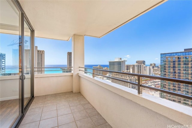 balcony with a view of city and a water view