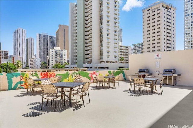 view of patio / terrace featuring a city view