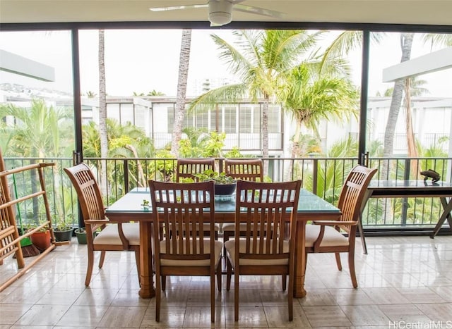 sunroom with plenty of natural light and ceiling fan