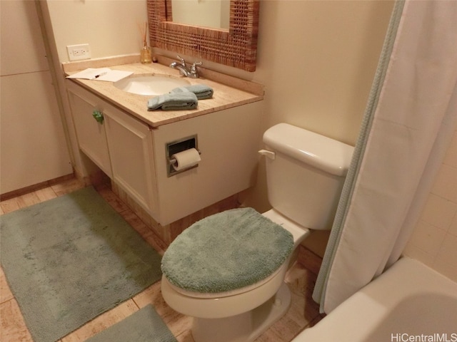 bathroom with vanity, toilet, a tub to relax in, and walk in shower