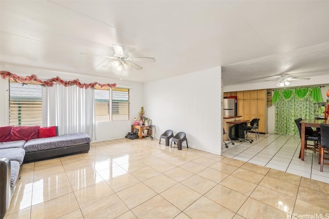 living room featuring light tile patterned floors and a ceiling fan