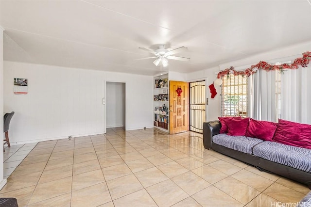 living room with light tile patterned flooring and a ceiling fan