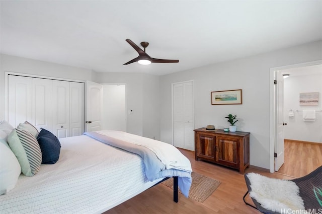 bedroom featuring a closet, baseboards, light wood-type flooring, and ceiling fan