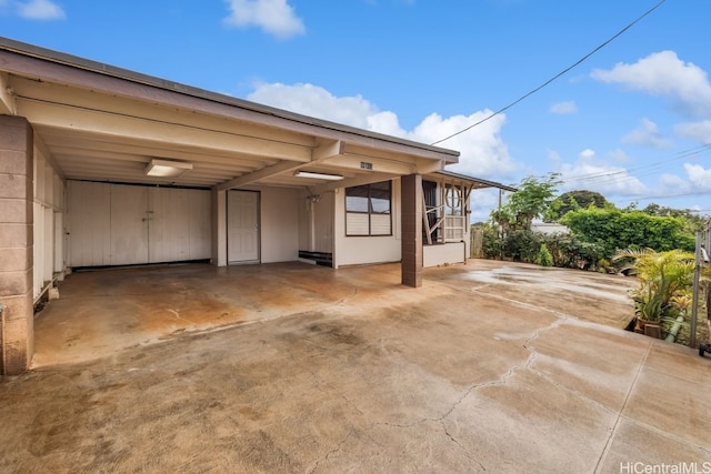 exterior space featuring a carport