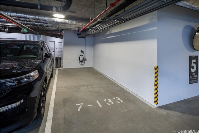 parking deck featuring concrete block wall