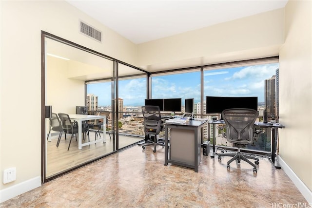 home office featuring visible vents and baseboards