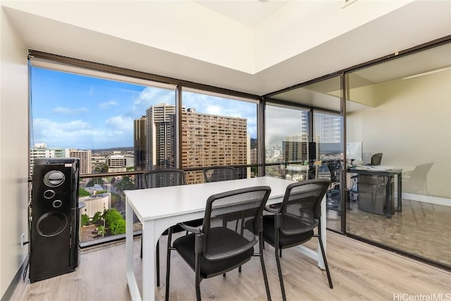 sunroom / solarium with a view of city