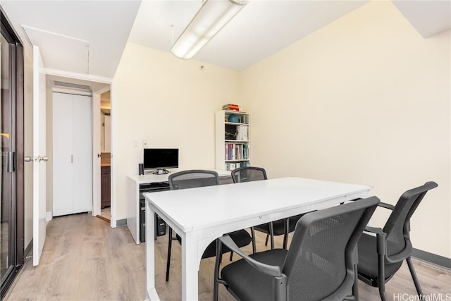 office featuring light wood-style flooring and baseboards