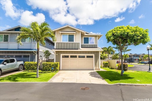 91-6221 Kapolei Pkwy Unit 201, Ewa Beach, HI 96706 - view of front facade with board and batten siding, an attached garage, concrete driveway, and a front lawn