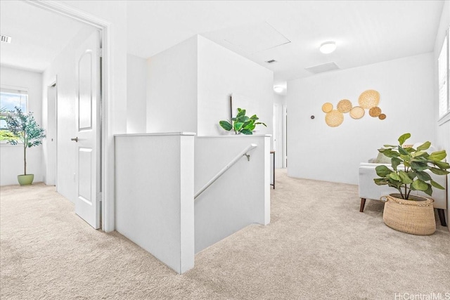 91-6221 Kapolei Pkwy Unit 201, Ewa Beach, HI 96706 - hall featuring an upstairs landing and light colored carpet