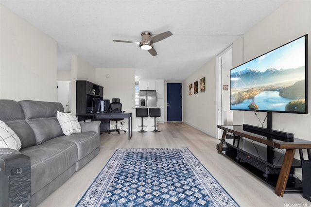 95-2027 Waikalani Pl Unit A404, Mililani, HI 96789 - living room featuring a ceiling fan, light wood finished floors, and an office area