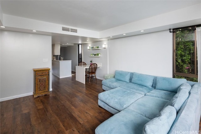 living room with recessed lighting, wood finished floors, visible vents, and baseboards