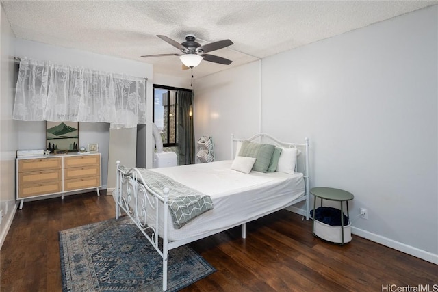 bedroom featuring ceiling fan, a textured ceiling, baseboards, and wood finished floors