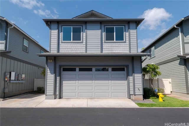 traditional home with concrete driveway and a garage