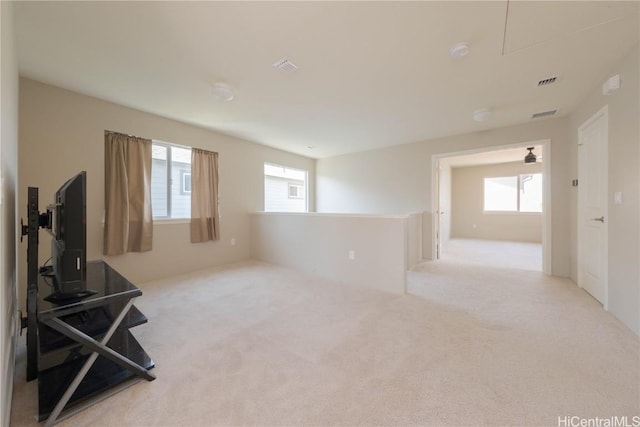 interior space with carpet flooring and visible vents