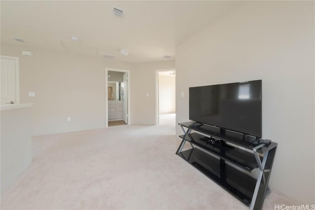 living room with visible vents and carpet