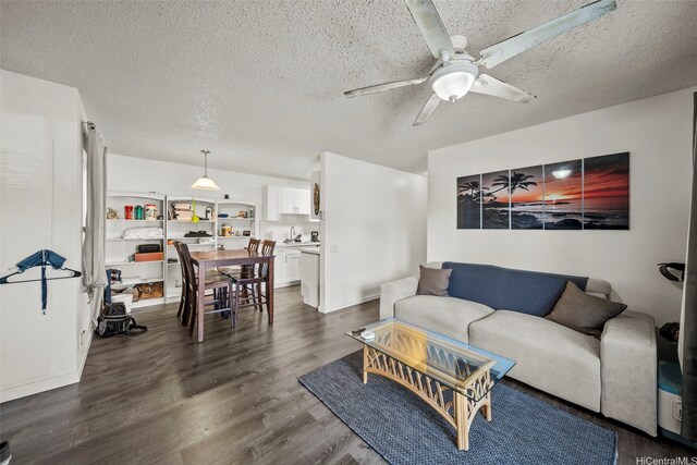 91-1018 Mikohu St Unit 20A, Ewa Beach, HI 96706 - living area featuring a ceiling fan, a textured ceiling, and dark wood-type flooring
