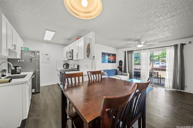 91-1018 Mikohu St Unit 20A, Ewa Beach, HI 96706 - dining room with a ceiling fan, a textured ceiling, and dark wood-type flooring