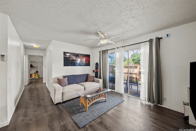 91-1018 Mikohu St Unit 20A, Ewa Beach, HI 96706 - living area with a textured ceiling, baseboards, wood finished floors, and a ceiling fan
