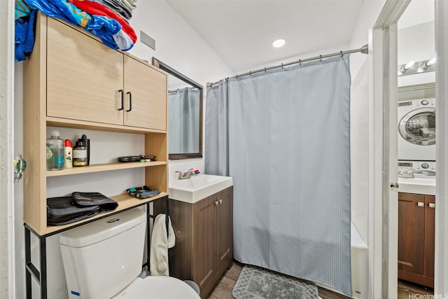 91-1018 Mikohu St Unit 20A, Ewa Beach, HI 96706 - bathroom with toilet, shower / tub combo with curtain, stacked washing maching and dryer, and vanity