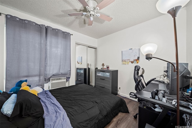 91-1018 Mikohu St Unit 20A, Ewa Beach, HI 96706 - bedroom featuring wood finished floors, a ceiling fan, a closet, a textured ceiling, and baseboards