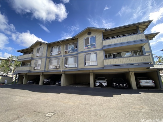 exterior space featuring covered parking