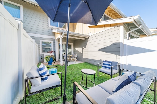 view of patio / terrace with an outdoor living space and fence