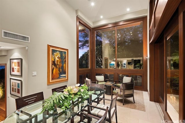 dining room featuring light tile patterned flooring and visible vents