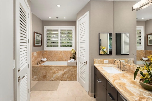 bathroom with vanity, tile patterned floors, a bath, and recessed lighting