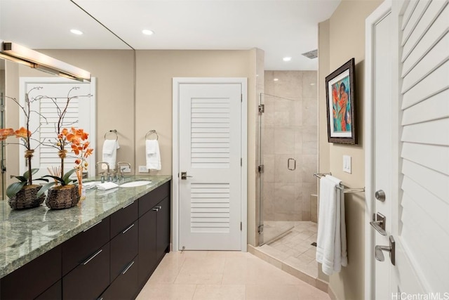 bathroom featuring vanity, a shower stall, recessed lighting, and visible vents