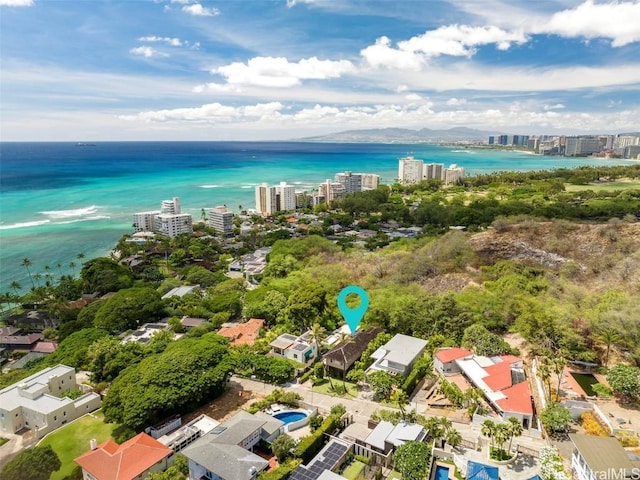 drone / aerial view featuring a view of city and a water view