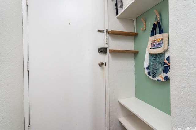 mudroom with a textured wall