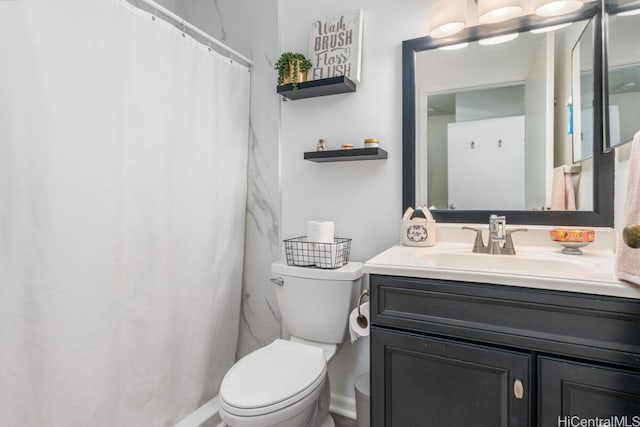 bathroom featuring a shower with shower curtain, toilet, and vanity