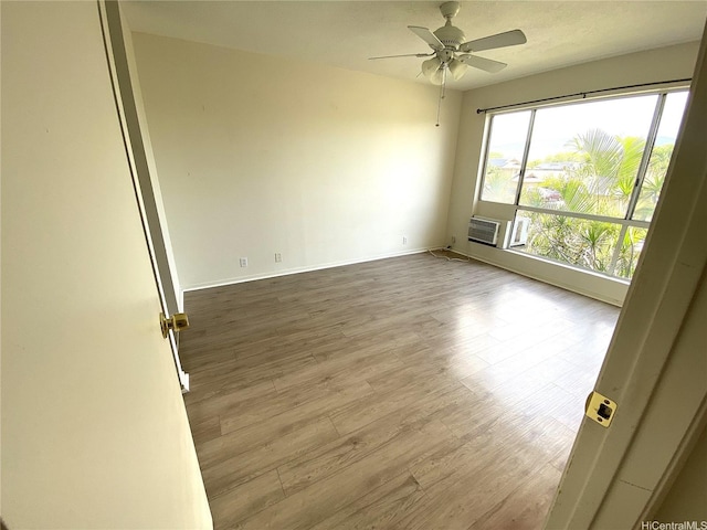 91-241 Hanapouli Cir Unit 24H, Ewa Beach, HI 96706 - spare room featuring wood finished floors, a ceiling fan, and cooling unit