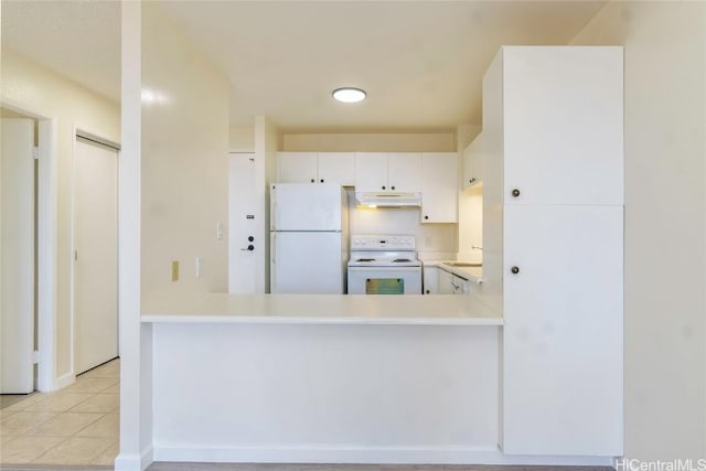 kitchen featuring white appliances, light tile patterned floors, light countertops, white cabinets, and under cabinet range hood